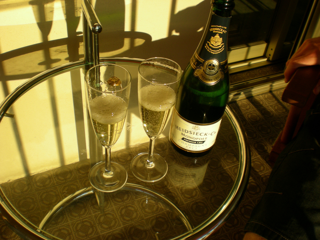 Heidsieck Co Monopole Champagne bottle served with two flutes